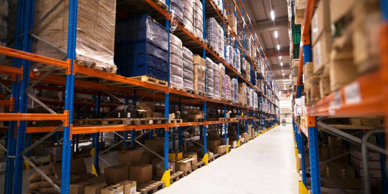 interior-large-distribution-warehouse-with-shelves-stacked-with-palettes-goods-ready-market (1)